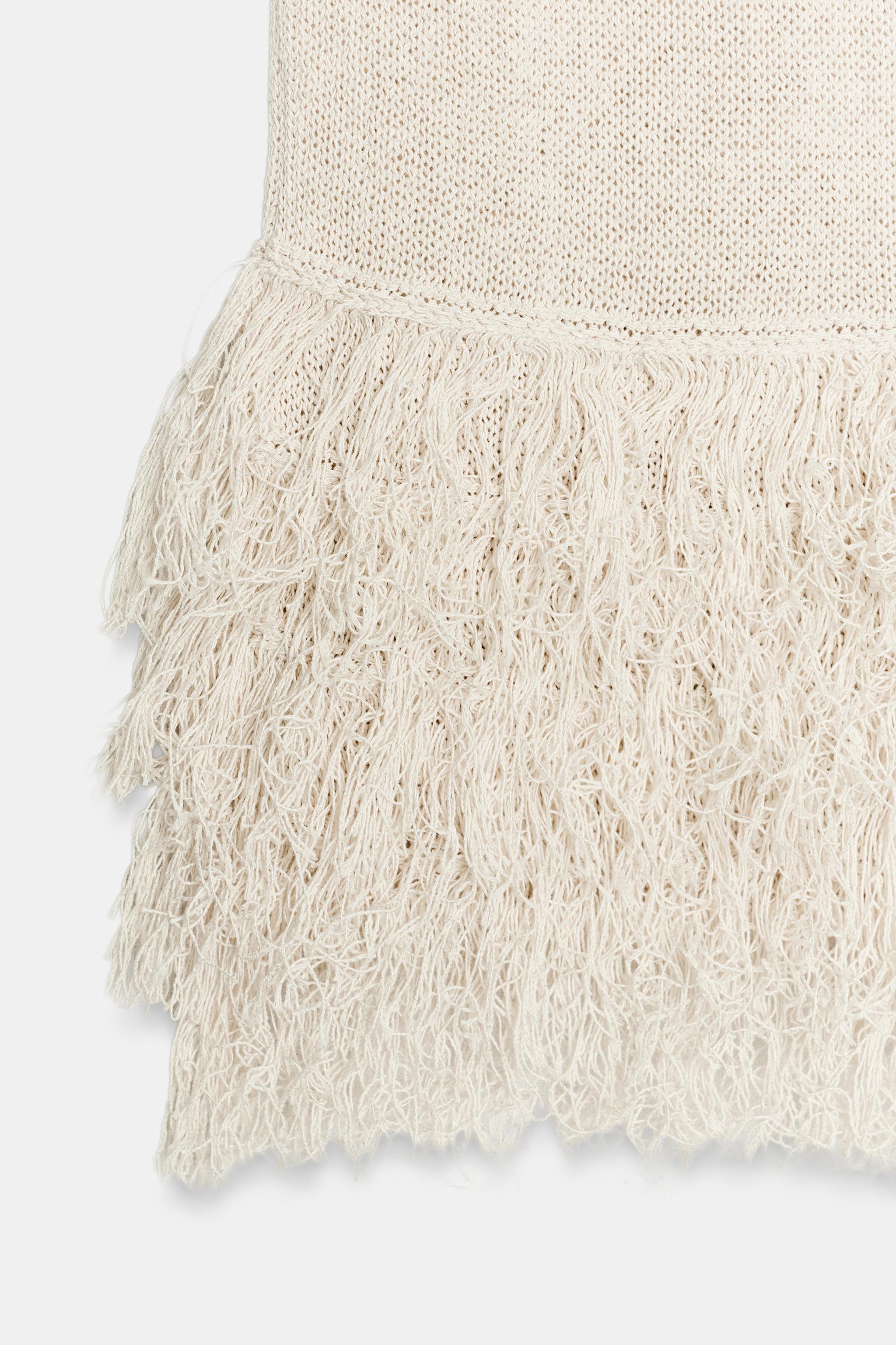 TOP EN MAILLE À FRANGES